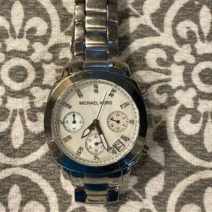 Michael Kors Silver Watch. Mother of Pearl face with rhinestone accents